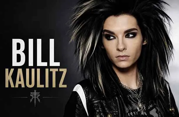 Bill Kaulitz in a dramatic rock-inspired portrait with long dark hair and black leather fashion